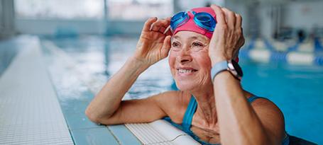 woman in the pool and smiling