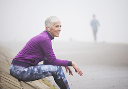 Woman sitting reflecting after a run